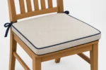 Measuring for custom chair cushions — dimensions taken edge to edge for an exact factory cut