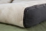 Custom dog bed cushions construction close-up — foam core, fabric and stitching detail
