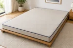 Custom futon cushions construction close-up — foam core, fabric and stitching detail