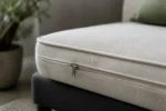 Custom sofa cushions construction close-up — foam core, fabric and stitching detail