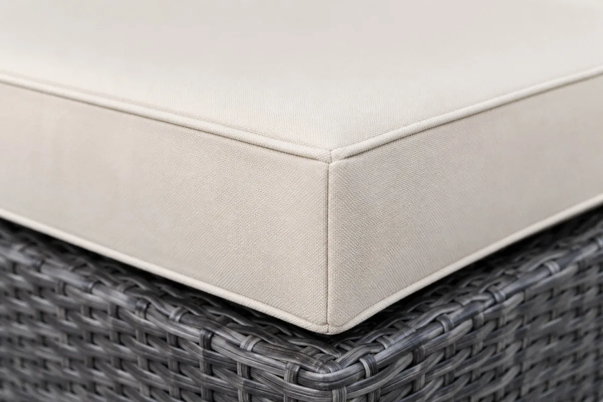 Custom wicker chair cushions construction close-up — foam core, fabric and stitching detail