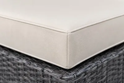 Custom wicker chair cushions construction close-up — foam core, fabric and stitching detail