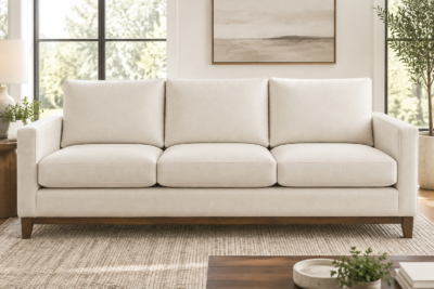 Ashley Larce sofa with ivory replacement cushions resting on the frame