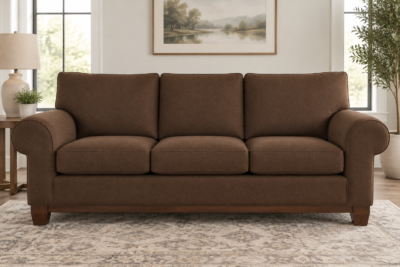 Ashley Tambo sofa with dark brown replacement cushions layered on the frame