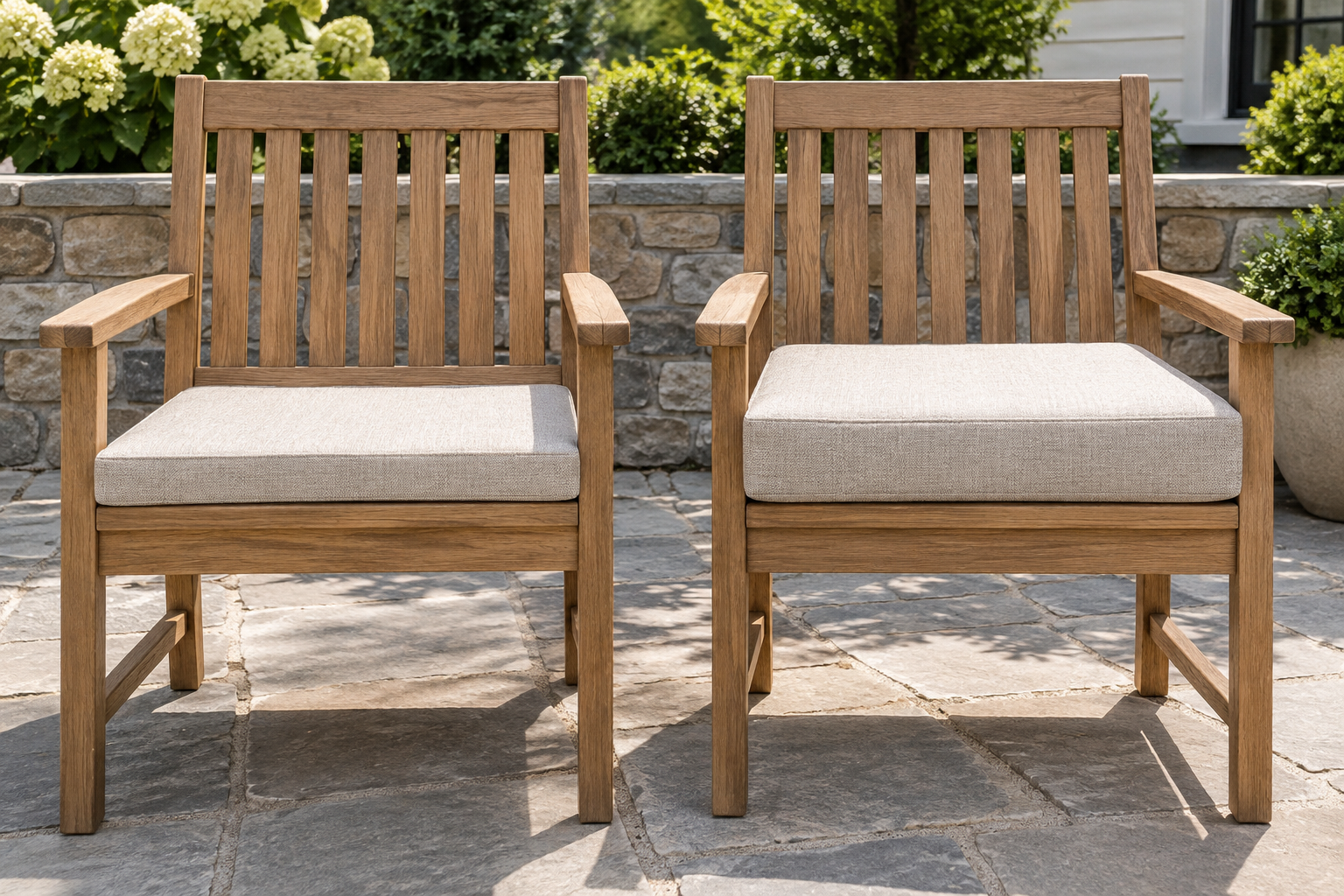 Two matching wooden patio chairs with visible legs and frames, each with a flat knife-edge seat cushion layered on top - one slim, one noticeably thicker