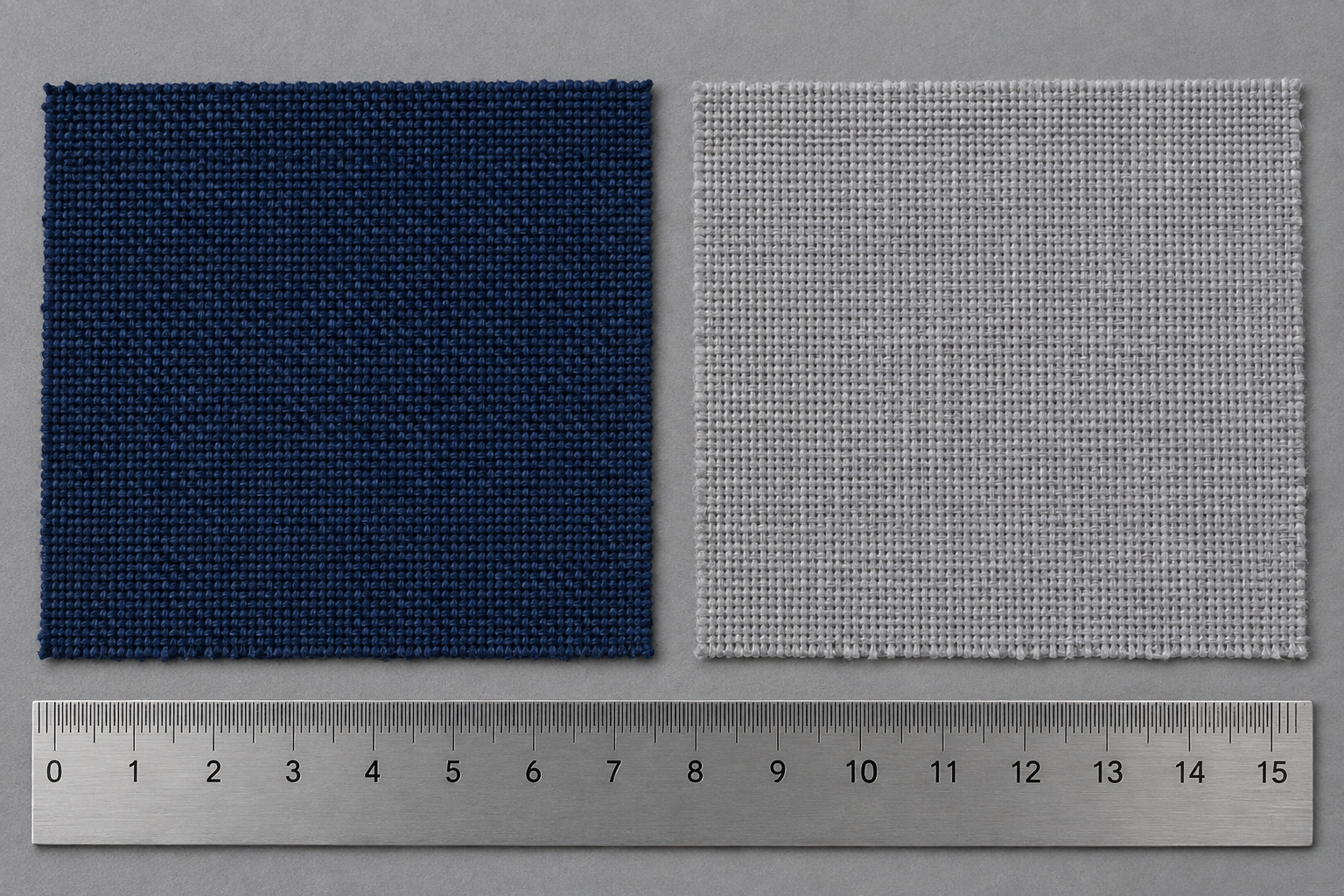 Two outdoor fabric swatches side by side - solution-dyed acrylic weave on the left, plain polyester on the right, with a steel ruler for scale - fabric price comparison