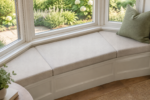 Firm flat-top trapezoid cushions fitted to a bay window bench, tight tailored seams, high-density foam