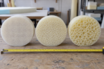 Cushion foam density grades compared - three cut foam discs with fine, medium and coarse cell structure side by side