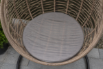 The egg chair cushion problem - a thin universal round pad flattened against the woven seat base, the rattan bars showing through