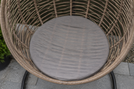 The egg chair cushion problem - a thin universal round pad flattened against the woven seat base, the rattan bars showing through