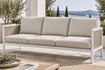 IKEA Havsten replacement cushions - flat knife-edge custom covers on a white aluminum wicker outdoor sofa in natural daylight