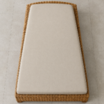 Overhead view of a wicker chaise cushion showing the straight front edge and curved back