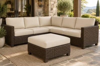 Dark wicker sectional with cream custom replacement cushions as separate layered pieces