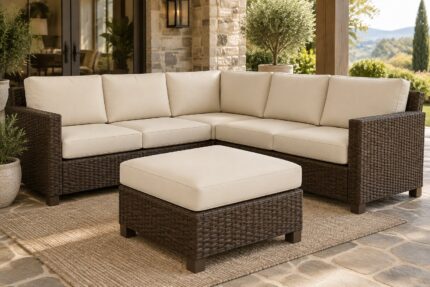 Dark wicker sectional with cream custom replacement cushions as separate layered pieces