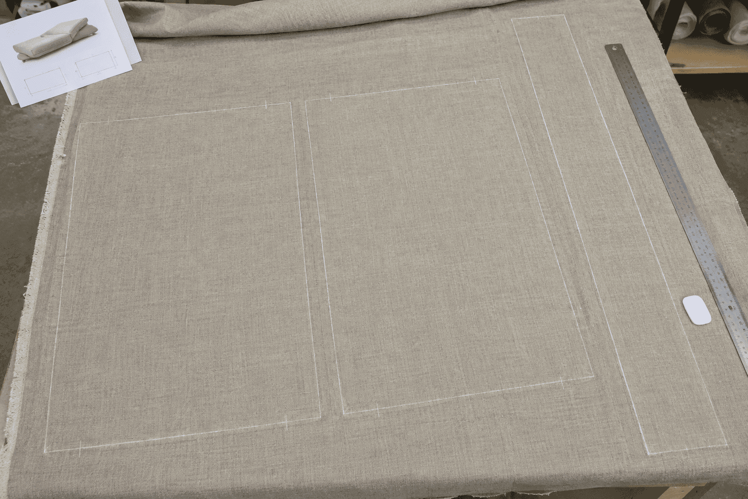Box cushion pattern pieces laid out on fabric with a continuous side band