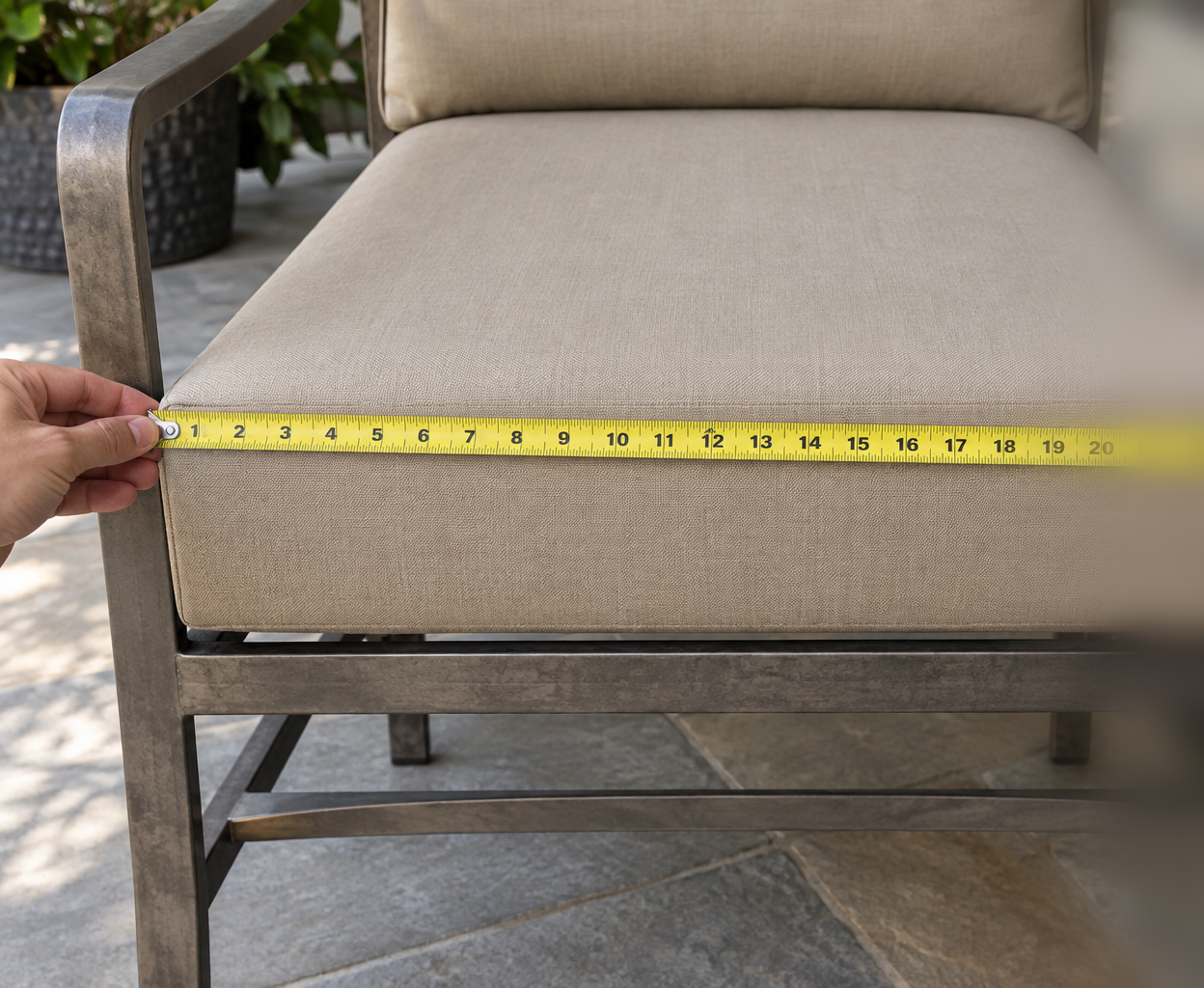 Measuring an OW Lee style deep-seat cushion edge to edge with a tape measure