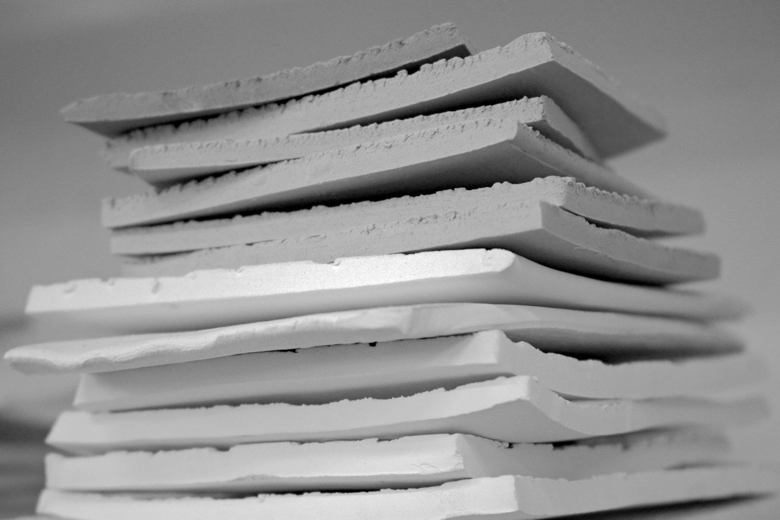 Stack of cut flexible polyurethane upholstery foam sheets in a workshop - upholstery foam is specified by density, thickness and cut size