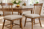 Pair of wooden dining chairs with new firm oatmeal replacement seat cushions at a farmhouse table
