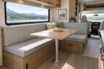 Custom RV dinette cushions - L-shaped camper booth with new firm gray seat and back pads in daylight
