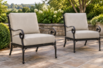 Pair of hand-forged wrought iron scrollwork armchairs with new stone beige replacement cushions