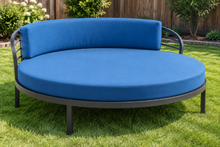 Round steel patio lounger rebuilt with a thick azure round cushion and curved back pad